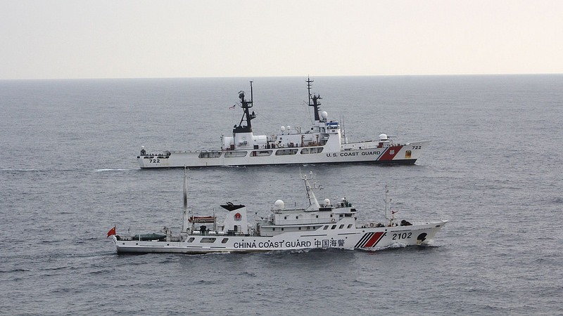 U.S. and China Coast Guard vessels interdicting illegal fishing in the North Pacific Ocean. A multilateral, paramilitary response in the South China Sea led by the United States could help deter conflict between China and its neighbors Vietnam and the Philippines. Source: Coast Guard News, U.S. Government Work